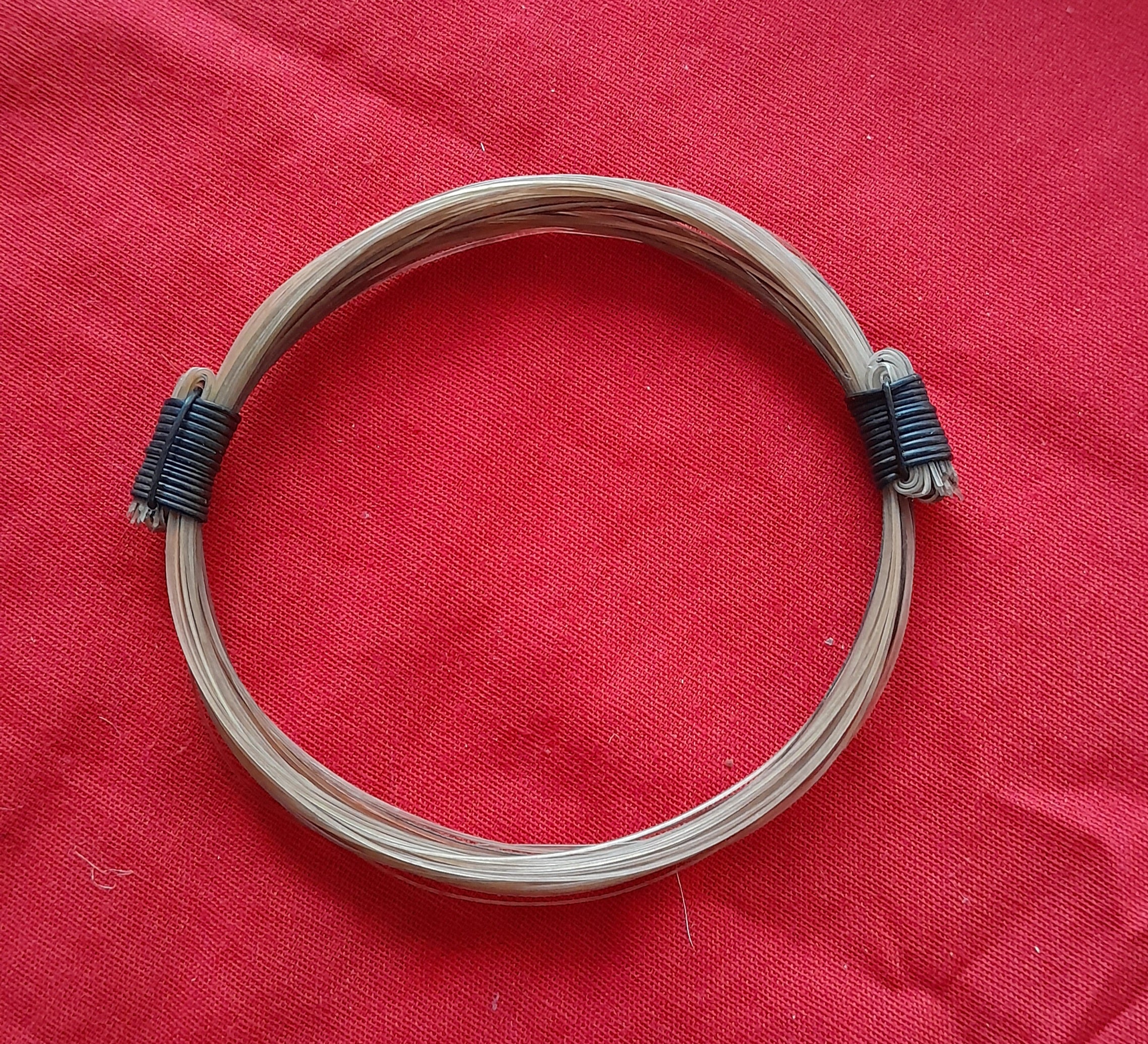 GIR11 Genuine off white giraffe hair bracelet with elephant hair knots.