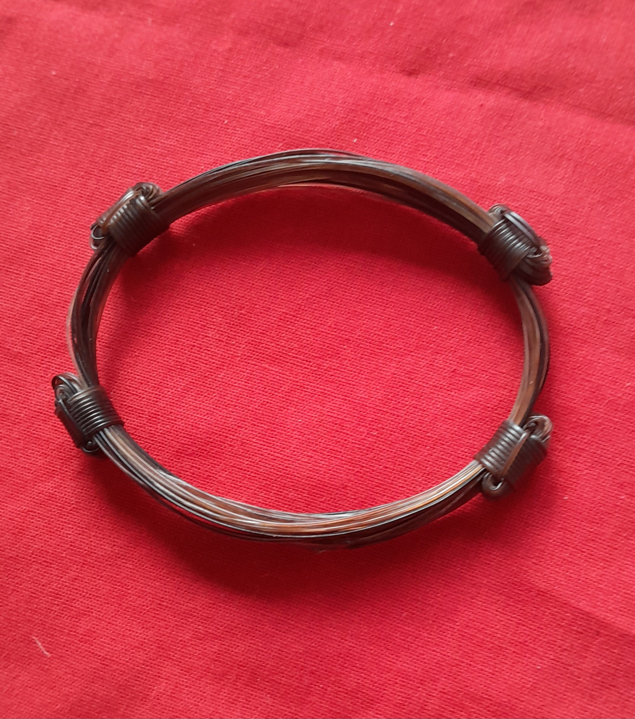 GIR18 Extremely unique choc brown 4 knot giraffe hair bracelet.