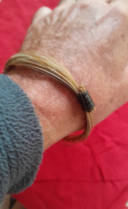 GIR11 Genuine off white giraffe hair bracelet with elephant hair knots.