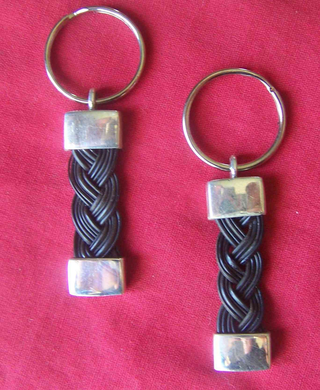 This set of 2 braided dark elephant hair keychains with sterling silver end-caps can be yours today for only $169. - KEYCHAIN