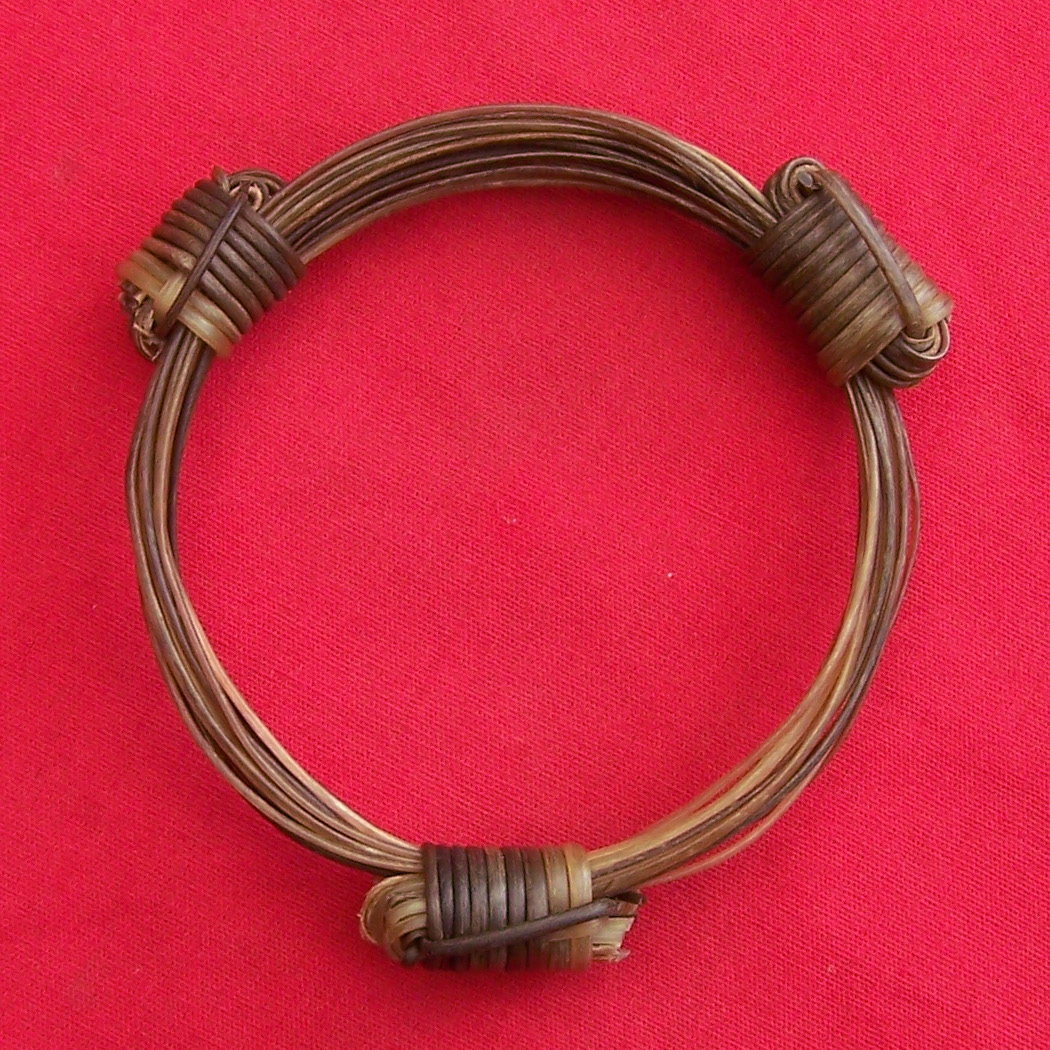 Very rare mix of light and dark brown and white elephant hairs. 3.5"/8.89cm in diameter, better suited to a medium to large wrist or as a bangle for a medium wrist. - JEB9