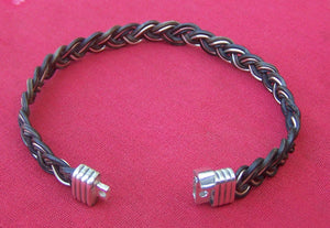 The sterling silver clasp clicks to close and secure the JEPP's combination of the lovely dark elephant hair and the serling silver filament weave to your wrist.