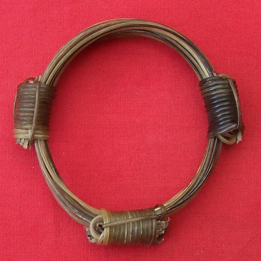 This collector's edition elephant hair bracelet consists of the finest rare white elephant hairs with the lightest of brown elephant hair, tied and fashioned with 3 contrasting knots. - JEW23