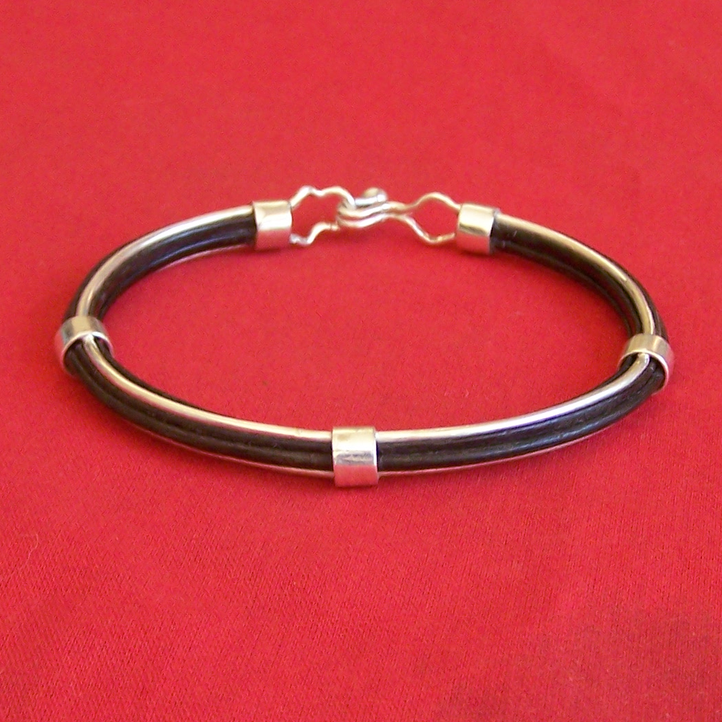 Lee's Collection #2 - 10 strands of thick elephant hair enclosed between 2 sterling silver wires and held in place by silver rings. Clip in clasp makes sure there is no unintended loosening.